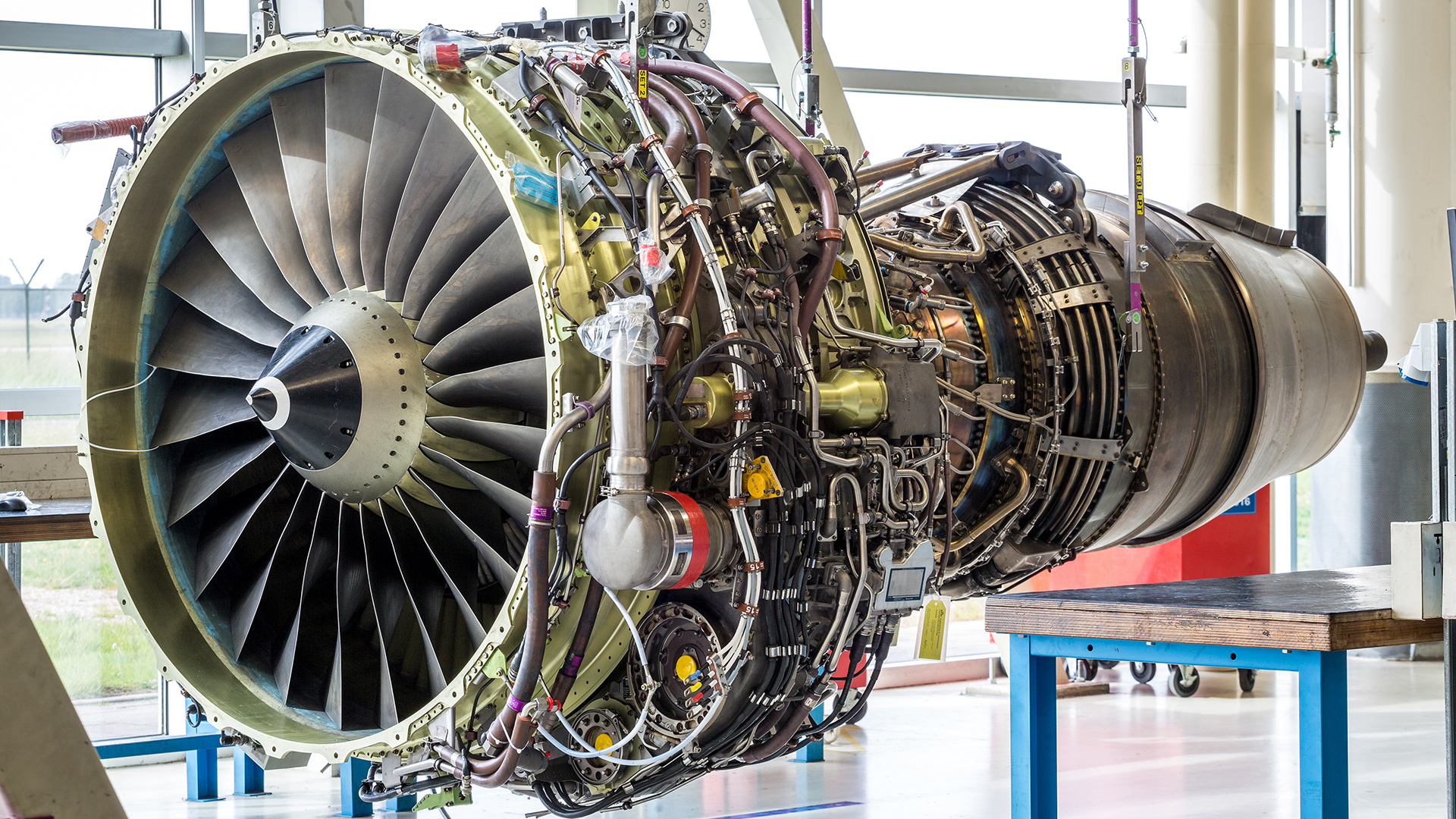 Aircraft jet engine in maintenance facility, representing how MRO management and aircraft maintenance software support inspections, repairs, and compliance tracking.